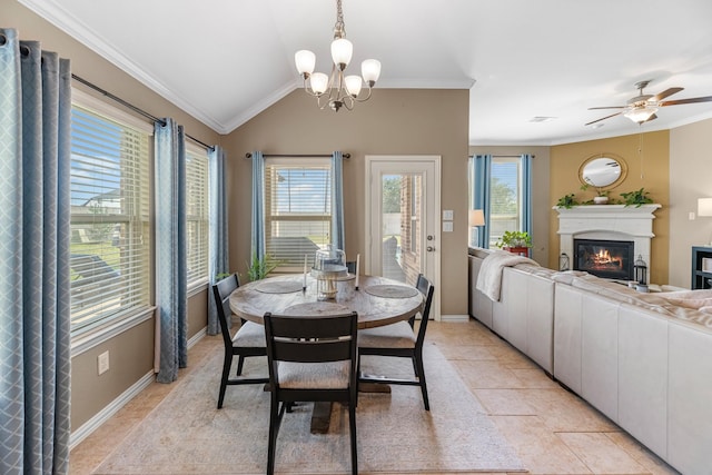20735 Cactus Lake Ln, Richmond, TX 77407 - dining space featuring ornamental molding, a glass covered fireplace, a chandelier, light tile patterned floors, and baseboards