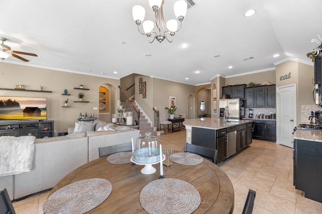20735 Cactus Lake Ln, Richmond, TX 77407 - dining room featuring arched walkways, stairs, ornamental molding, recessed lighting, and a ceiling fan