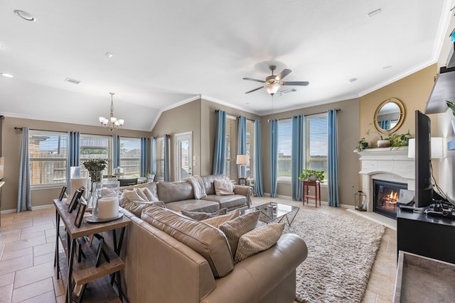 20735 Cactus Lake Ln, Richmond, TX 77407 - living area with a chandelier, ornamental molding, baseboards, a ceiling fan, and a fireplace