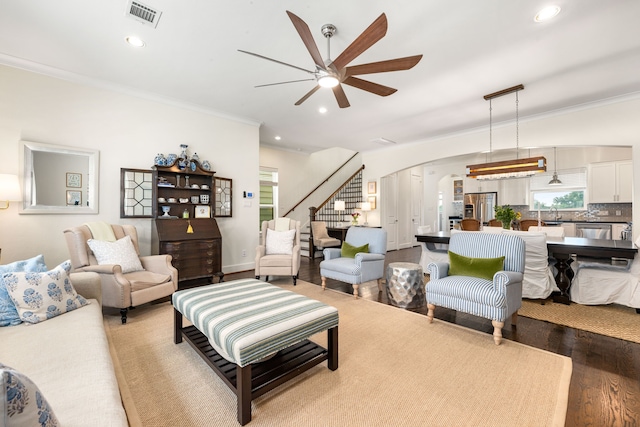 829 Wakefield Dr Unit A, Houston, TX 77018 - living area with wood finished floors, a ceiling fan, stairway, arched walkways, and ornamental molding
