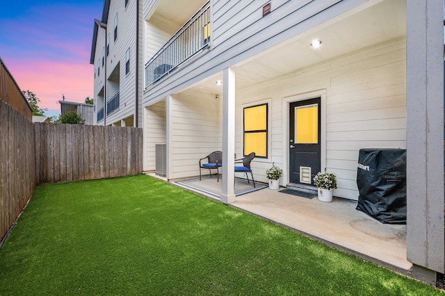 829 Wakefield Dr Unit A, Houston, TX 77018 - yard at dusk with a patio area and a balcony