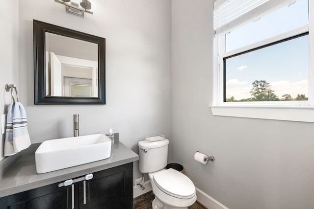 829 Wakefield Dr Unit A, Houston, TX 77018 - bathroom featuring toilet, baseboards, vanity, and wood finished floors