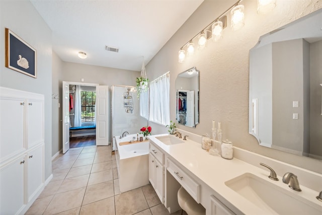 full bath with tile patterned flooring, a stall shower, a garden tub, and double vanity