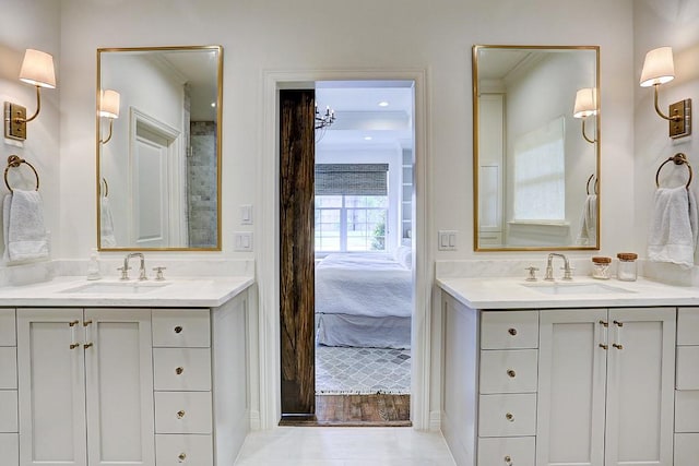 5326 Windswept Ln, Houston, TX 77056 - full bathroom featuring two vanities, crown molding, and connected bathroom