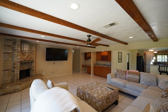 18907 Oak Bower Dr, Humble, TX 77346 - living area with light tile patterned flooring, beam ceiling, ceiling fan, baseboards, and recessed lighting