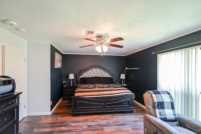 18907 Oak Bower Dr, Humble, TX 77346 - bedroom with wood finished floors, baseboards, ceiling fan, a textured ceiling, and crown molding