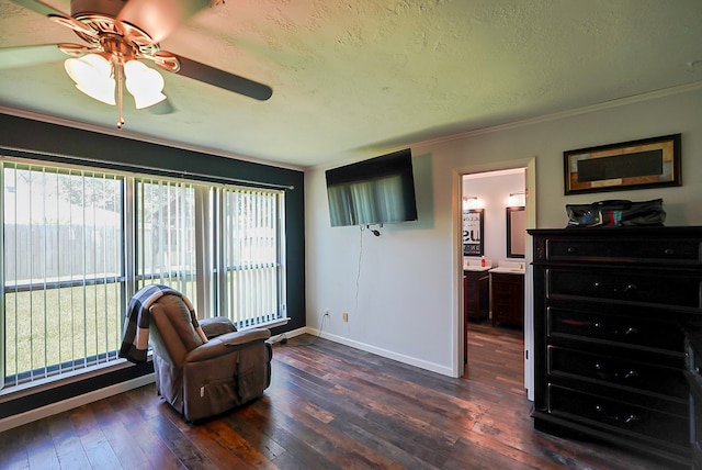 18907 Oak Bower Dr, Humble, TX 77346 - sitting room with ceiling fan, dark wood finished floors, baseboards, a textured ceiling, and ornamental molding