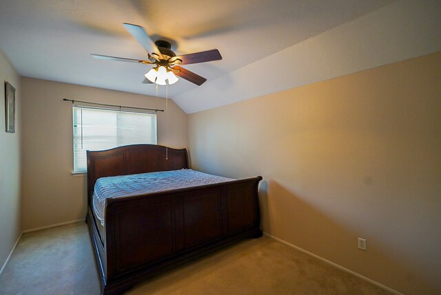 18907 Oak Bower Dr, Humble, TX 77346 - bedroom featuring light carpet, baseboards, a ceiling fan, and vaulted ceiling