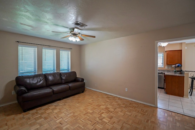 18907 Oak Bower Dr, Humble, TX 77346 - living area with a ceiling fan and baseboards