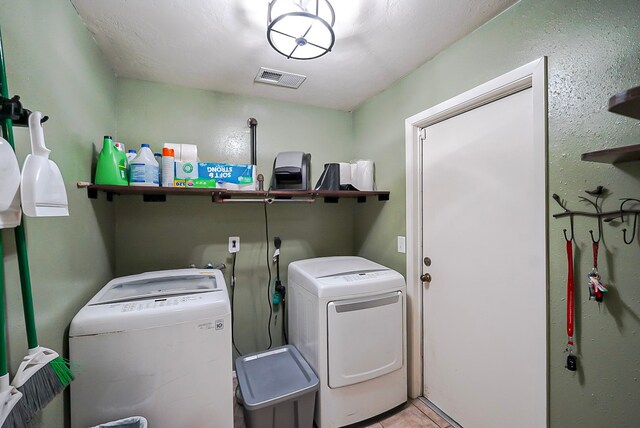 18907 Oak Bower Dr, Humble, TX 77346 - clothes washing area featuring washer and clothes dryer and tile patterned floors
