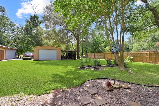 13111 Oak Plaza Dr, Cypress, TX 77429 - view of yard featuring an outbuilding, a detached garage, and view of wooded area