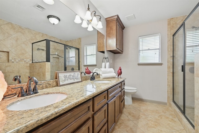 13111 Oak Plaza Dr, Cypress, TX 77429 - full bathroom featuring a stall shower, double vanity, tile patterned flooring, and toilet