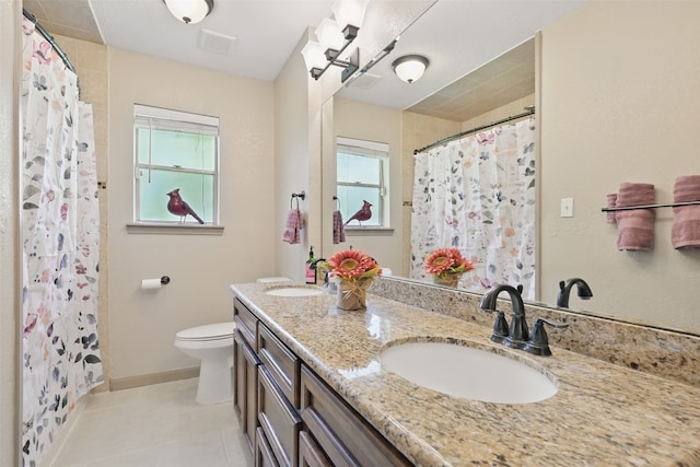 13111 Oak Plaza Dr, Cypress, TX 77429 - bathroom featuring toilet, tile patterned floors, double vanity, baseboards, and curtained shower
