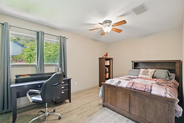 13111 Oak Plaza Dr, Cypress, TX 77429 - bedroom featuring light wood-style flooring, a desk, and ceiling fan