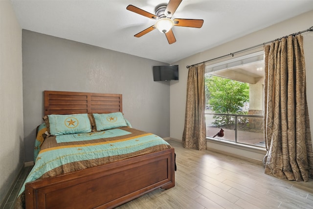 13111 Oak Plaza Dr, Cypress, TX 77429 - bedroom with wood finished floors, baseboards, and a ceiling fan