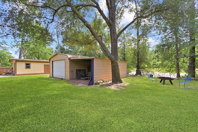 13111 Oak Plaza Dr, Cypress, TX 77429 - view of yard featuring a detached garage and an outbuilding
