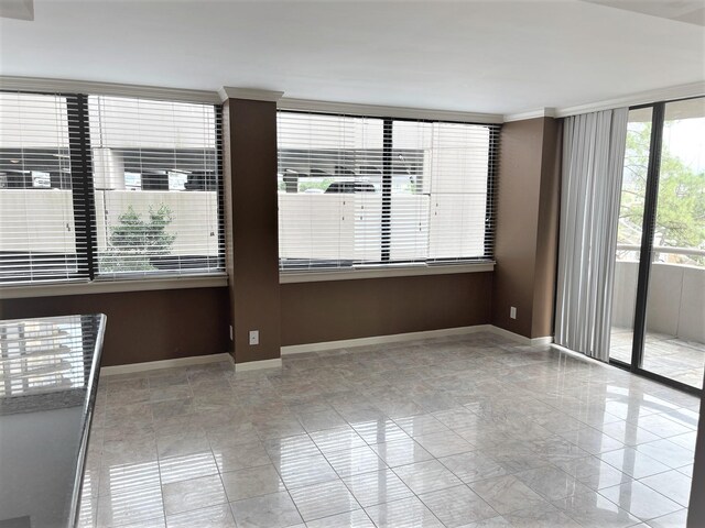3525 Sage Rd Unit 404, Houston, TX 77056 - empty room featuring baseboards and ornamental molding