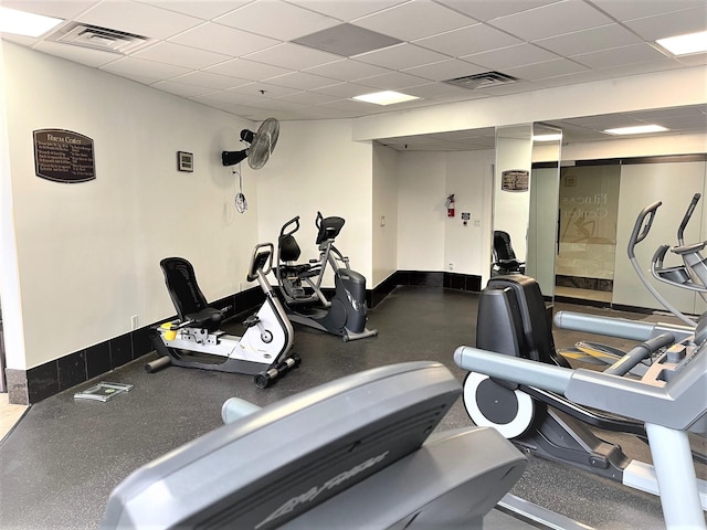 3525 Sage Rd Unit 404, Houston, TX 77056 - gym featuring a drop ceiling and baseboards