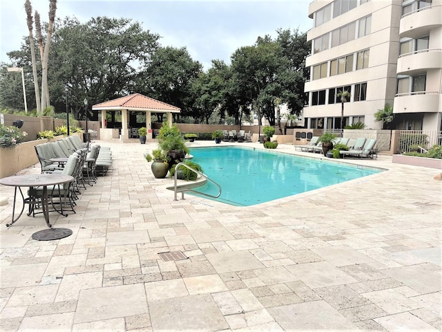 3525 Sage Rd Unit 404, Houston, TX 77056 - community pool featuring a gazebo, a patio area, and fence