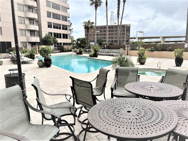 3525 Sage Rd Unit 404, Houston, TX 77056 - community pool featuring a patio area and fence