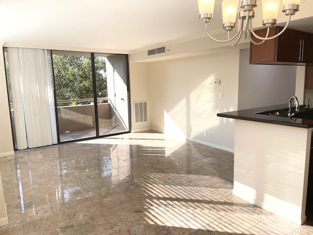 3525 Sage Rd Unit 404, Houston, TX 77056 - unfurnished dining area with a sink, baseboards, a chandelier, expansive windows, and marble tiled flooring
