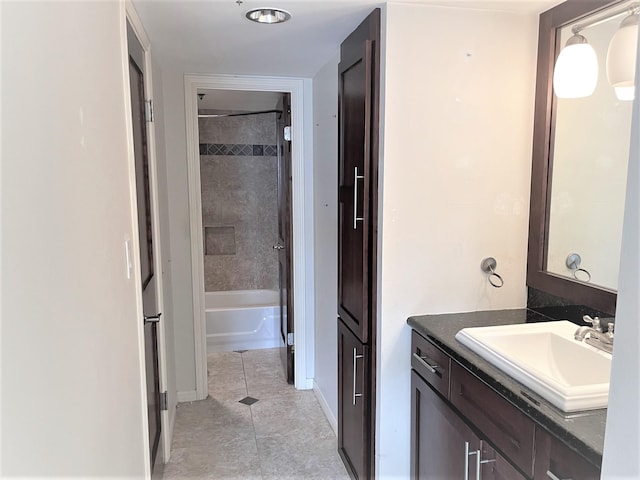 3525 Sage Rd Unit 404, Houston, TX 77056 - full bath with vanity, baseboards, tile patterned flooring, and shower / bath combination