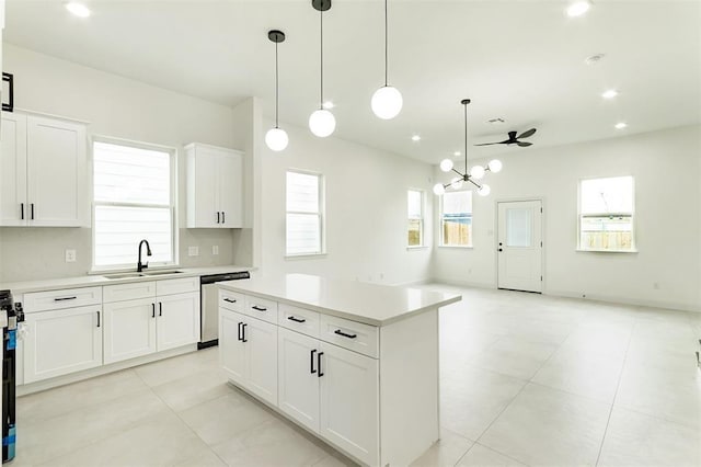 4008 Bennington St, Houston, TX 77016 - kitchen with a sink, stainless steel dishwasher, light countertops, a kitchen island, and recessed lighting