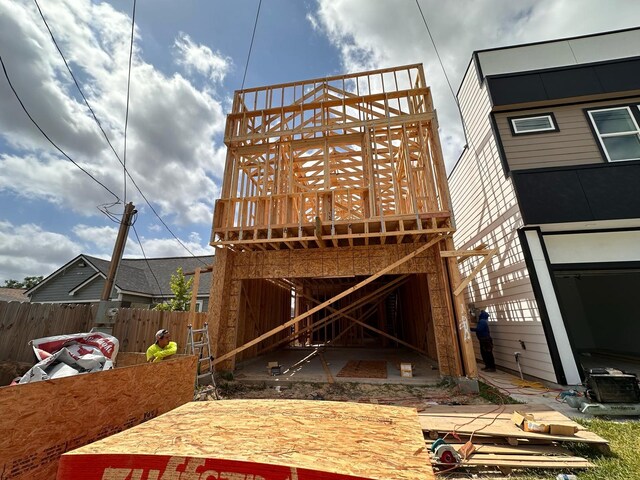 4008 Bennington St, Houston, TX 77016 - rear view of house with fence and a deck