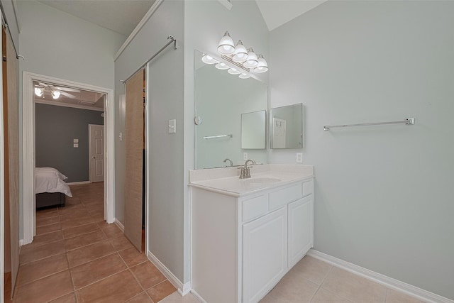 21122 Lilac Meadows Ln, Richmond, TX 77407 - bathroom featuring tile patterned floors, vanity, baseboards, a ceiling fan, and lofted ceiling