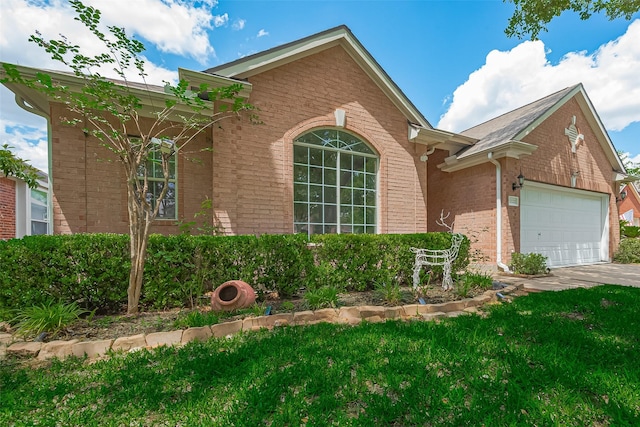 21122 Lilac Meadows Ln, Richmond, TX 77407 - single story home with brick siding, a front yard, and an attached garage