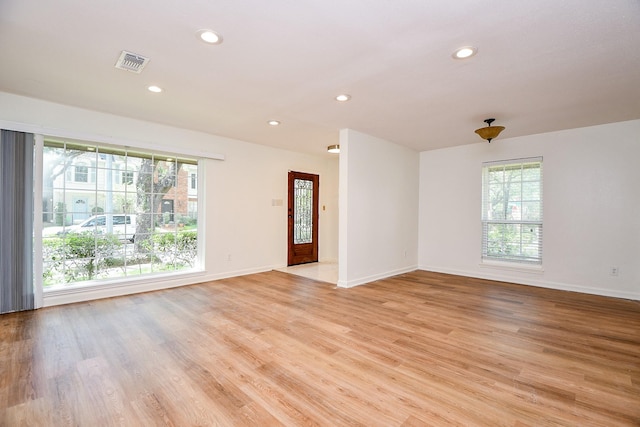 500 N Post Oak Ln, Houston, TX 77024 - empty room featuring plenty of natural light, light wood-style floors, recessed lighting, and baseboards
