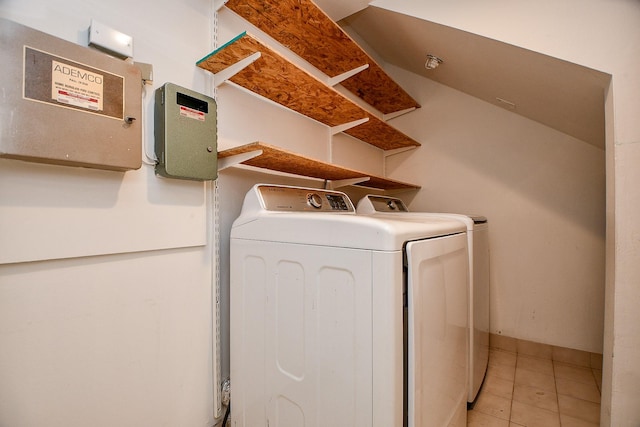 500 N Post Oak Ln, Houston, TX 77024 - laundry room with washer and dryer and light tile patterned floors