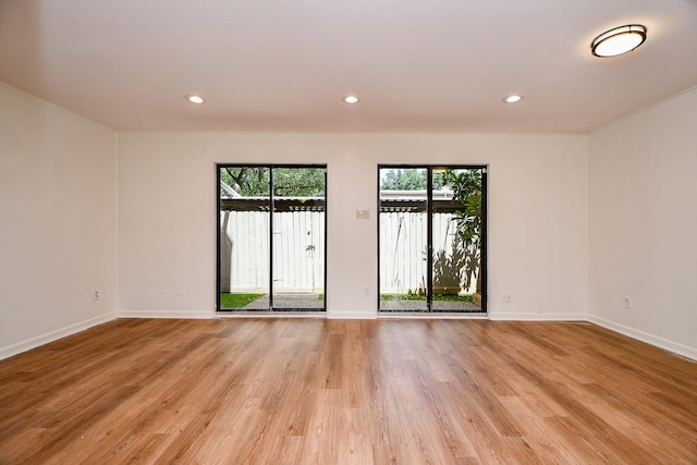 500 N Post Oak Ln, Houston, TX 77024 - unfurnished room featuring light wood-type flooring, baseboards, and recessed lighting