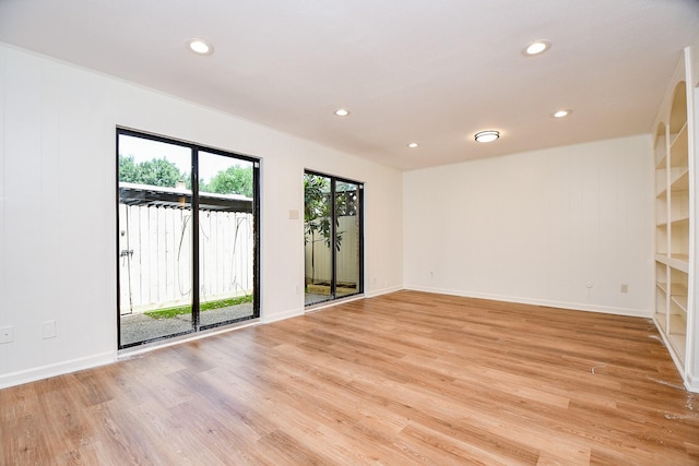 500 N Post Oak Ln, Houston, TX 77024 - unfurnished room with light wood finished floors, recessed lighting, and baseboards