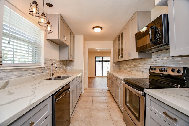 500 N Post Oak Ln, Houston, TX 77024 - kitchen featuring stainless steel electric range, dishwashing machine, a sink, black microwave, and gray cabinetry