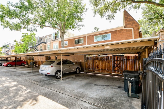 500 N Post Oak Ln, Houston, TX 77024 - covered parking lot with fence
