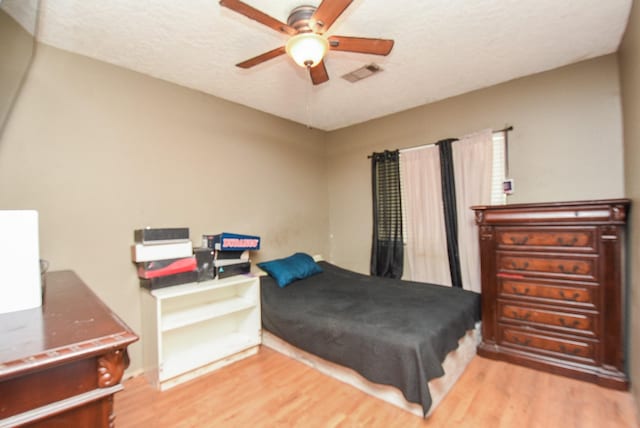 130 Ben Dr, Houston, TX 77022 - bedroom with light wood-type flooring and ceiling fan