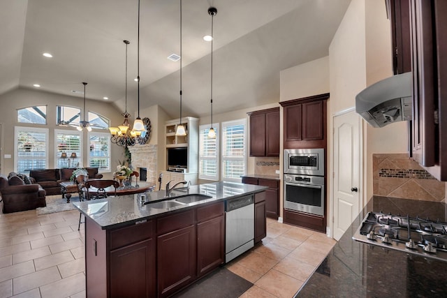 18 Homed Lark Pl, Spring, TX 77389 - kitchen with stainless steel appliances, a sink, open floor plan, backsplash, and recessed lighting