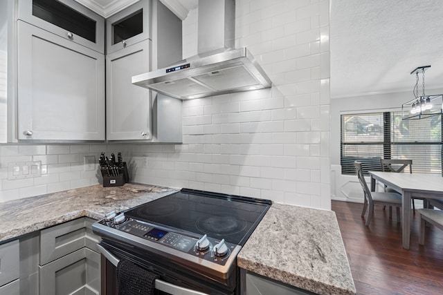 22338 Prince George St, Katy, TX 77449 - kitchen featuring wall chimney range hood, electric range, ornamental molding, tasteful backsplash, and dark wood finished floors
