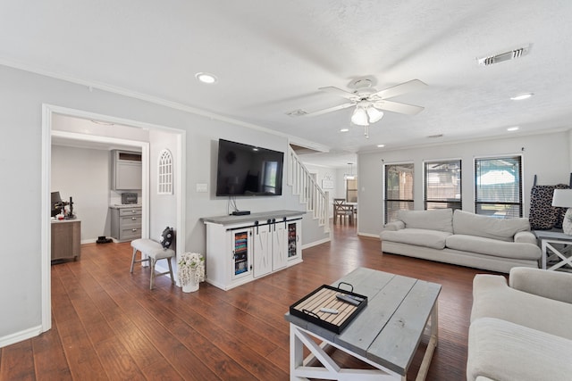 22338 Prince George St, Katy, TX 77449 - living area with ornamental molding, baseboards, stairway, ceiling fan, and recessed lighting