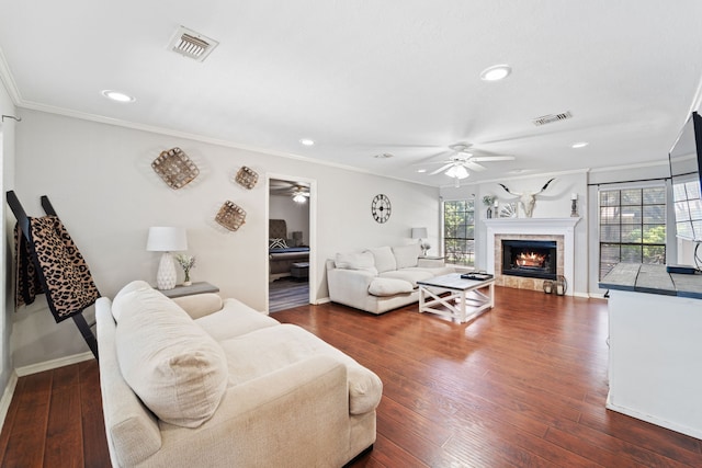 22338 Prince George St, Katy, TX 77449 - living room with a ceiling fan, a tiled fireplace, baseboards, recessed lighting, and ornamental molding
