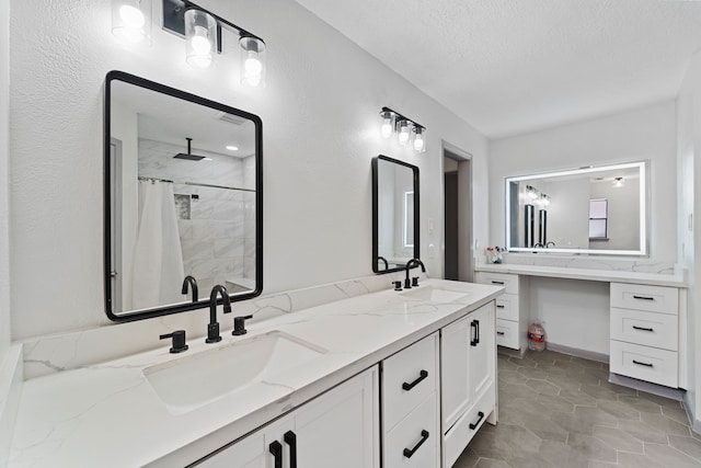 22338 Prince George St, Katy, TX 77449 - full bath featuring a textured ceiling, double vanity, and a tile shower