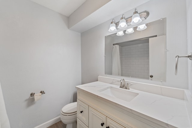 22338 Prince George St, Katy, TX 77449 - full bathroom with toilet, vanity, curtained shower, wood finished floors, and baseboards