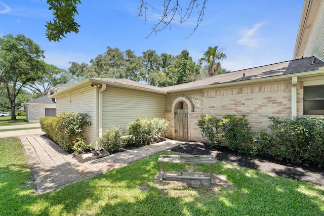 22338 Prince George St, Katy, TX 77449 - property entrance featuring brick siding, a lawn, and a shingled roof