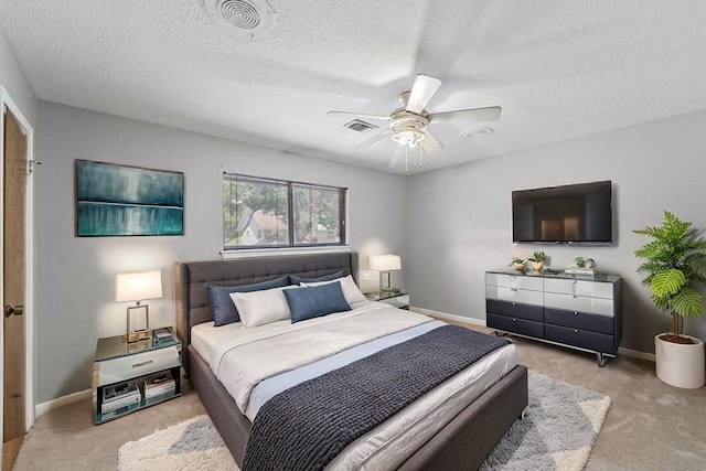 22338 Prince George St, Katy, TX 77449 - bedroom with light colored carpet, baseboards, a textured ceiling, and ceiling fan