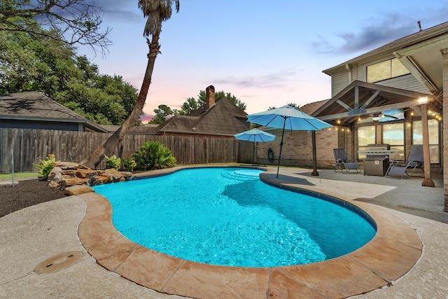 22338 Prince George St, Katy, TX 77449 - pool at dusk with a patio area, a fenced backyard, and ceiling fan