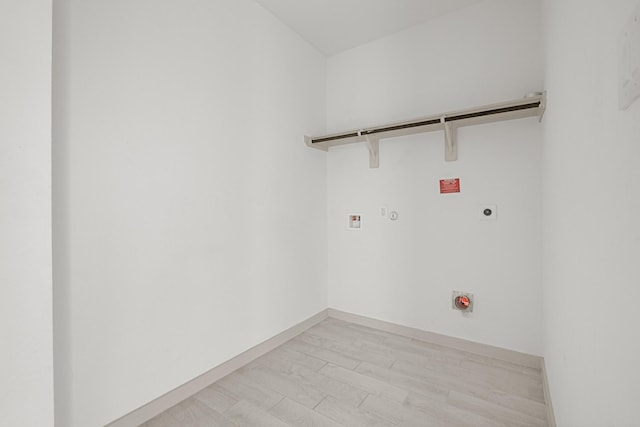 clothes washing area with hookup for an electric dryer, hookup for a gas dryer, and hookup for a washing machine