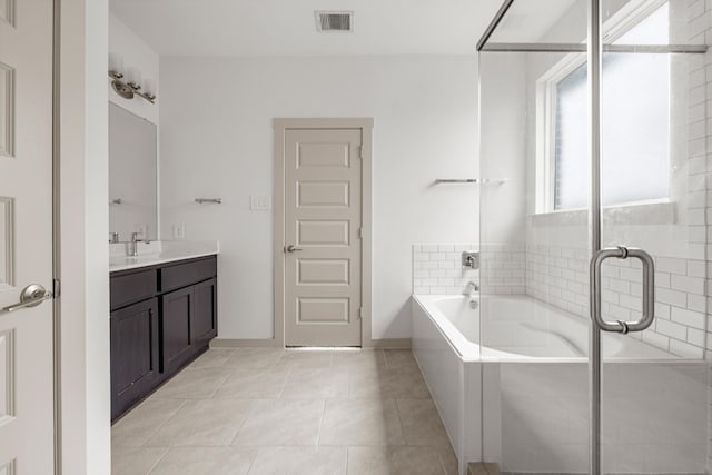 full bath with a garden tub, vanity, tile patterned flooring, and a shower with shower door