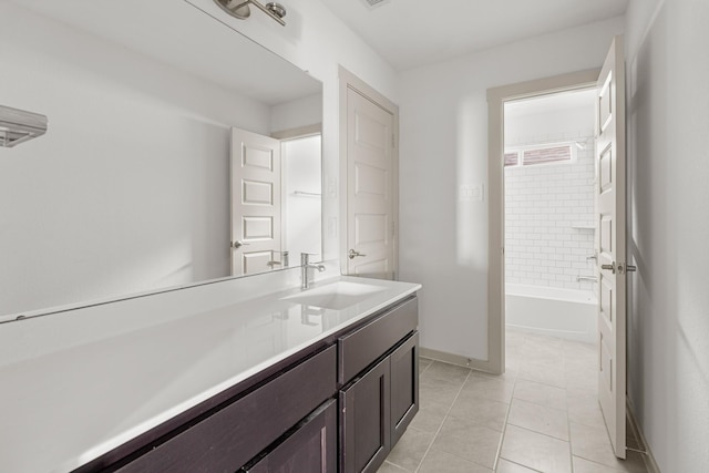 full bath with vanity and baseboards
