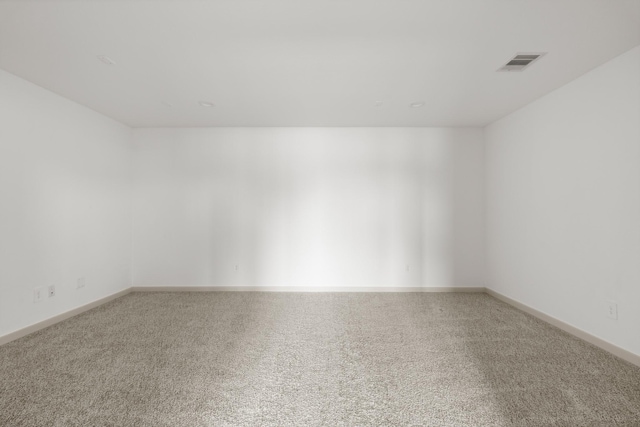 empty room with carpet flooring and baseboards